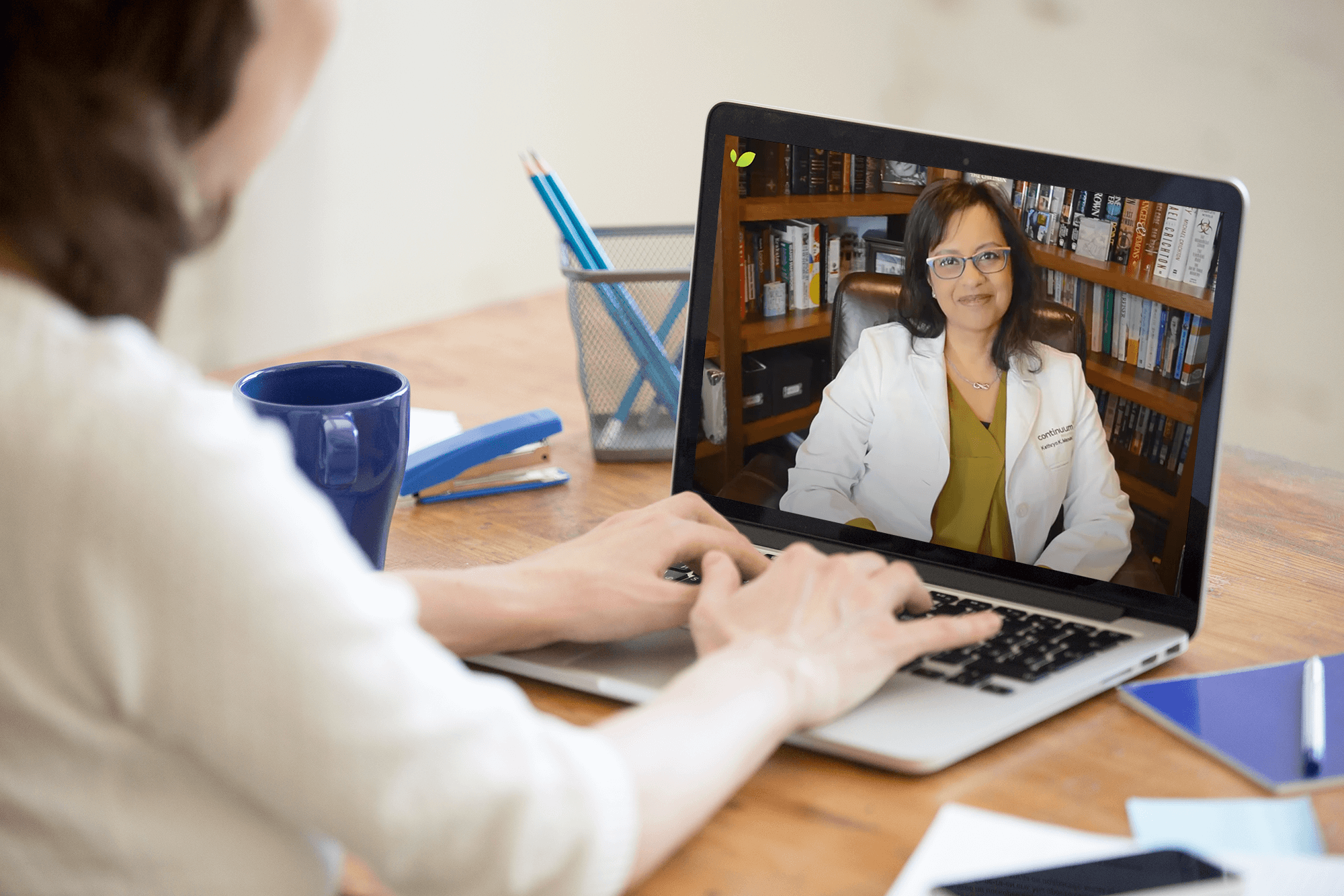 A patient consults with their doctor through a virtual telemedicine appointment, utilizing technology to bridge the distance between healthcare provider and patient.