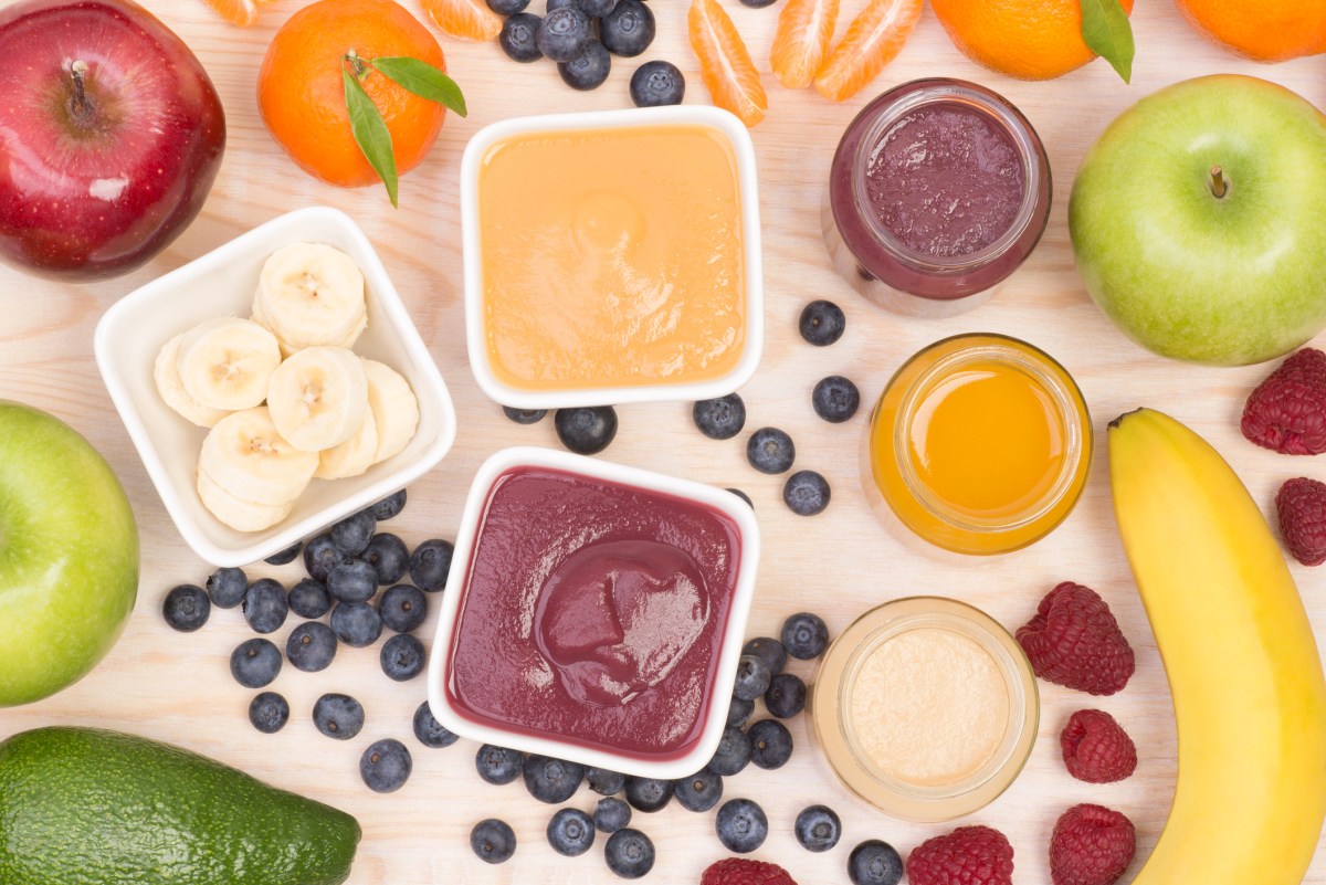 A colorful array of nutritious baby food and fresh fruits, providing essential vitamins and minerals for healthy growth and development.