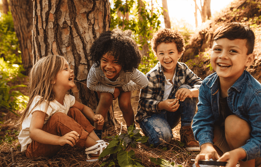 Happy children play joyfully outdoors, surrounded by the vibrant colors of autumn.