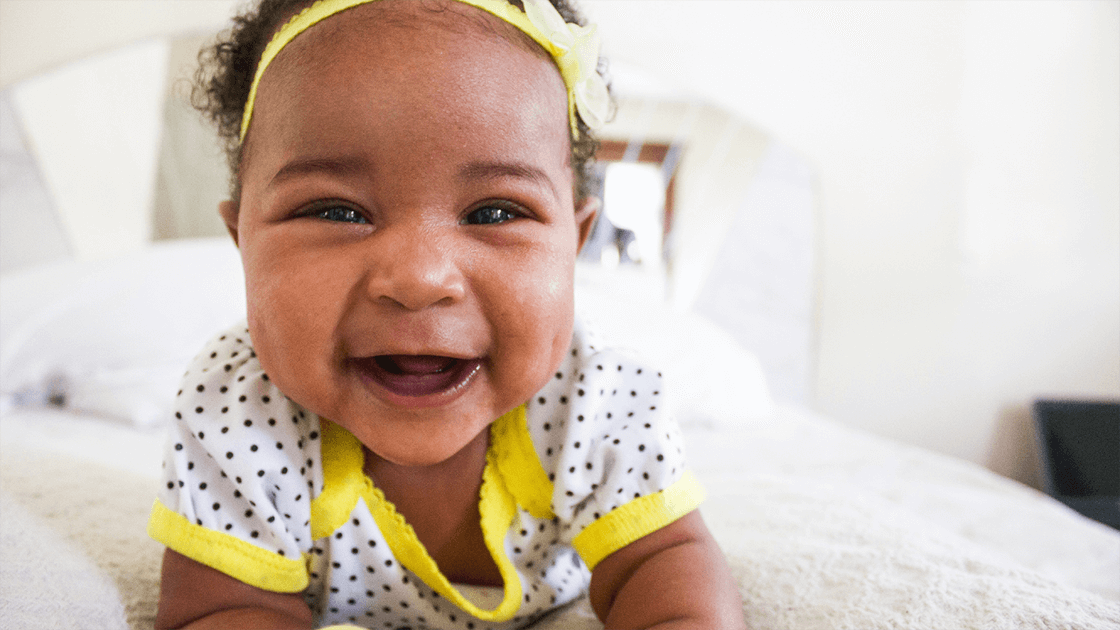 Smiling baby symbolizing the how babies have growth spurts