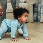 Baby on hands and knees, preparing to crawl