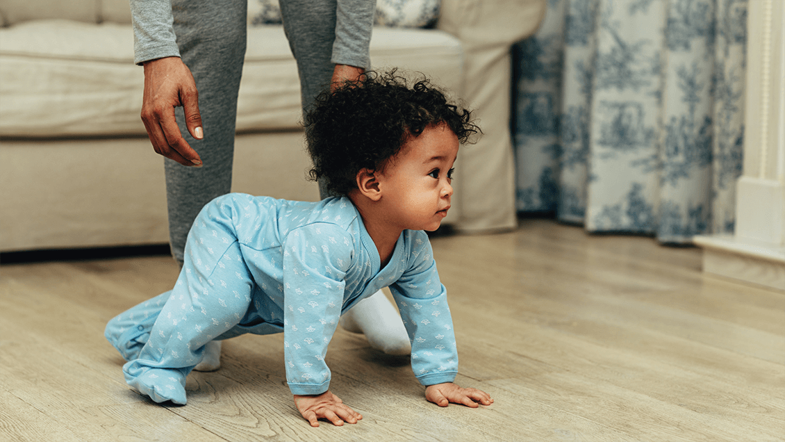 Baby on hands and knees, preparing to crawl