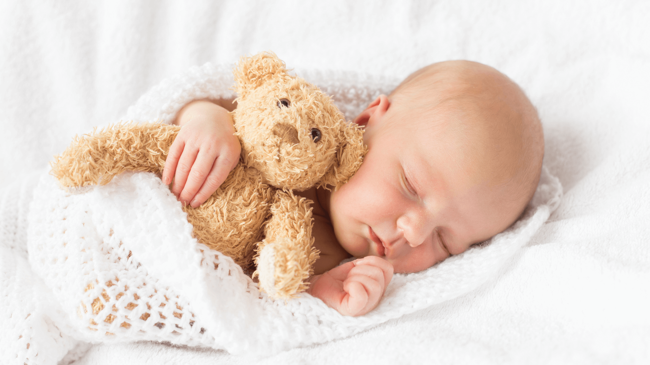 Baby sleeping peacefully, relevant to tips for extending newborn sleep.